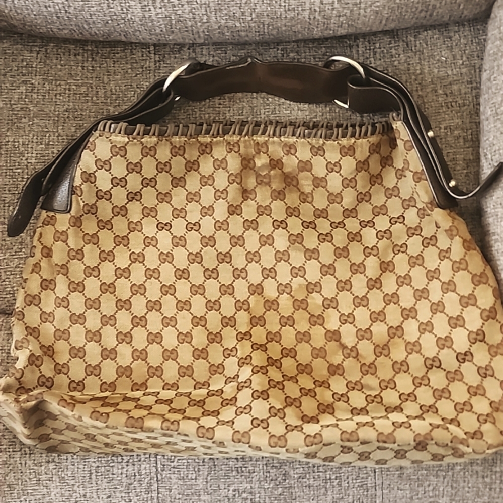 Gucci bag some stains